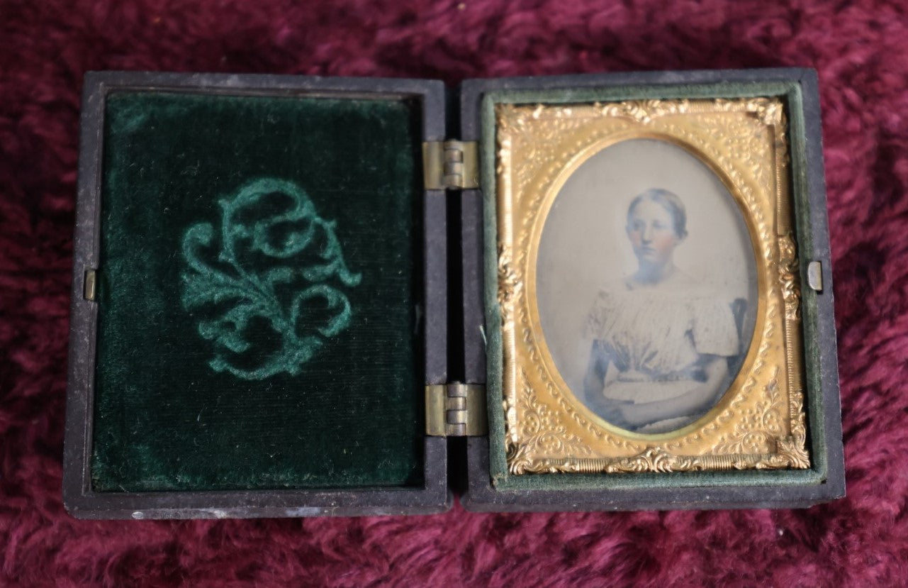 Lot 163 - 1/9Th Plate Ambrtoype Of Young Woman In Thermoplastic Case, Green Pillow, Pears On Case