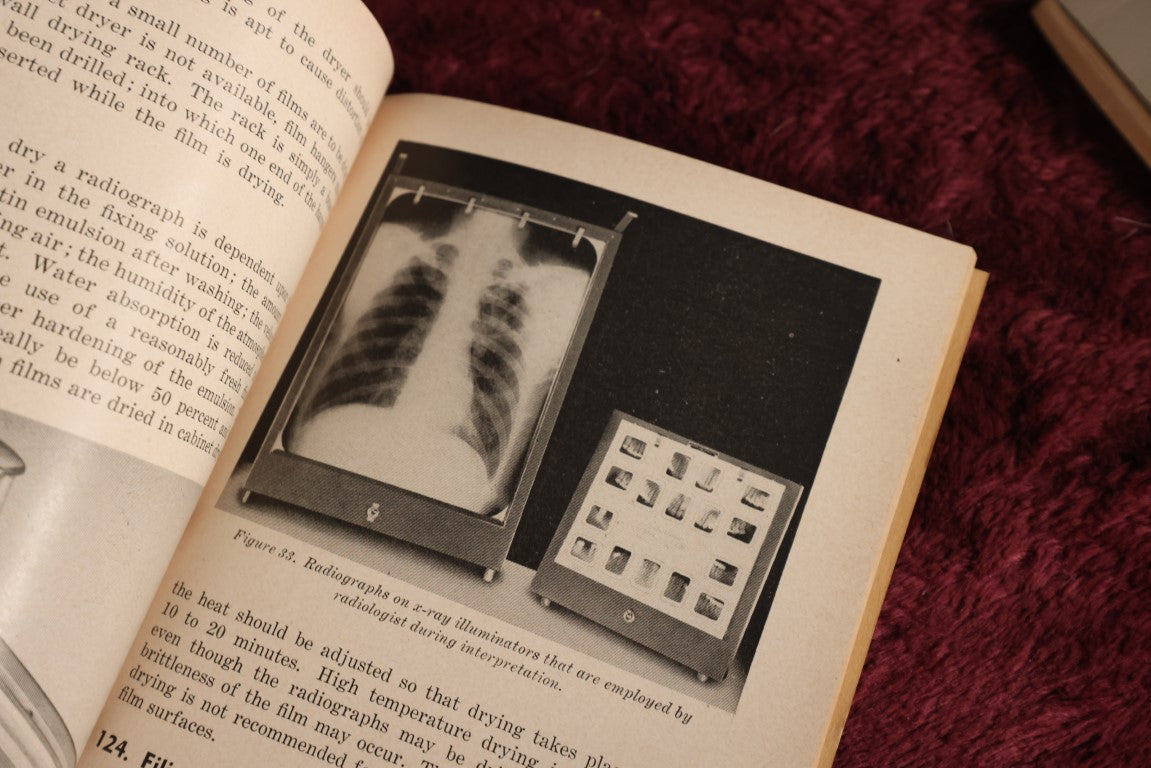 Lot 144 - Three Piece Medical Ephemera Grouping - Principles Of Radiographic Exposure, X-Ray Film Processing, And The American Red Cross First Aid Text Book