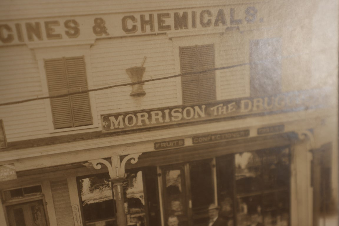 Lot 038 - Antique Boarded Photo Of C.W. Morrison Store On Main Street, Meredith, New Hampshire, "Morrison The Druggist," Many Signs And Advertisements