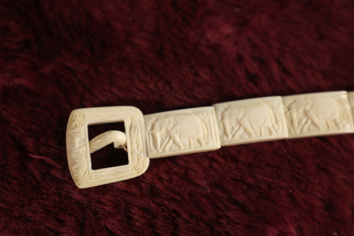 Lot 052 - Five Piece Grouping Of Carved Bone And Antler Jewelry, Including Clip On Earrings, Carbed Bone Bracelet With Elephant Motif, Pair Of Hand Painted Antler Stem Brooches