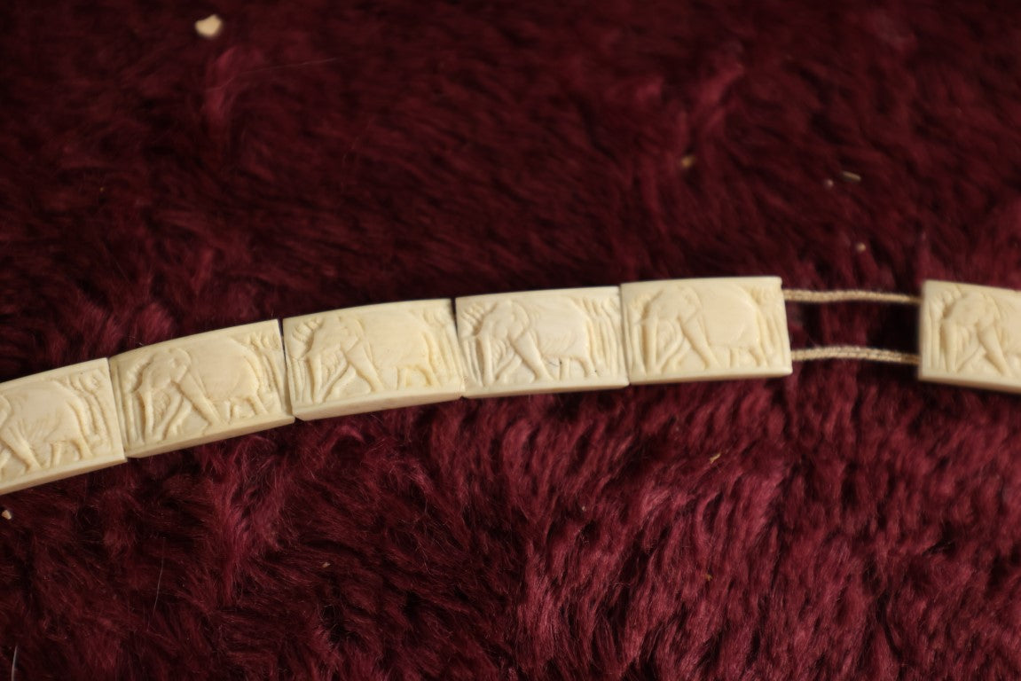 Lot 052 - Five Piece Grouping Of Carved Bone And Antler Jewelry, Including Clip On Earrings, Carbed Bone Bracelet With Elephant Motif, Pair Of Hand Painted Antler Stem Brooches