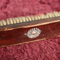 Lot 059 - Antique Wooden Dresser Brush With Sterling Silver Pendant Badge Decoration, Marked Sterling