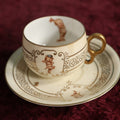 Lot 062 - Antique Royal Munich Kewpie Decorated Tea Cup And Saucer, Rose O'Neill, Marked Bavaria, Note Hairlines In Teacup