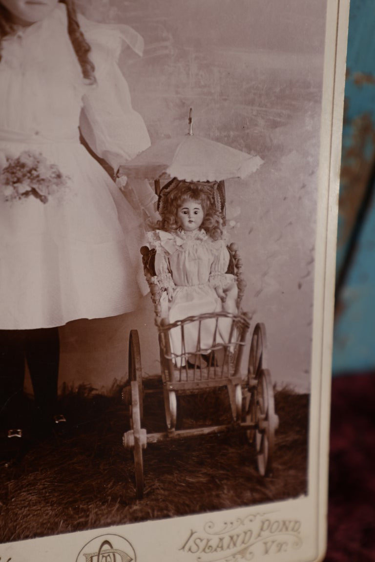 Lot 072 - Antique Cabinet Card Photo Of Young Girl With Doll In Pram, Davis Photographer, Island Pond, Vermont