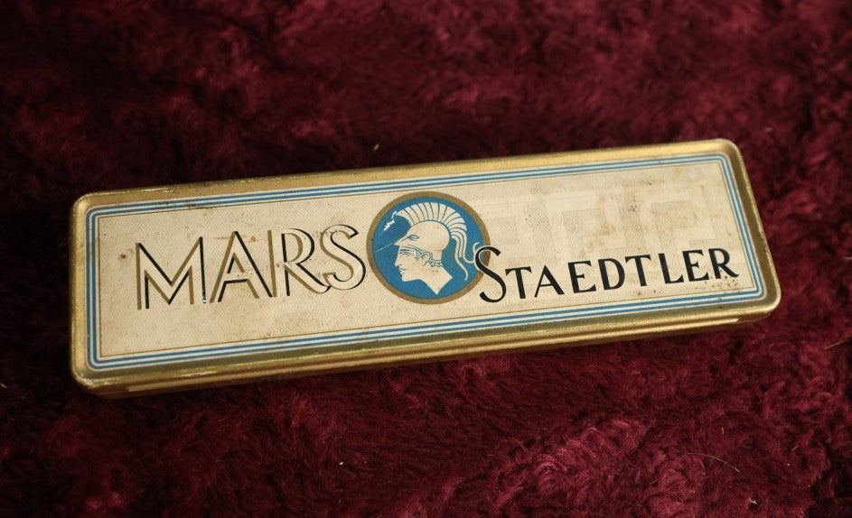 Lot 111 - Vintage New Old Stock Mars Staedtler Mars-Lumograph No. 2886 Pencils, Made In Germany, Eight Pencils And Tin