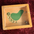 Lot 126 - Vintage Novelty Dexterity Ball Game With Green Foot