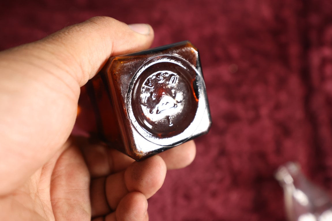 Lot 132 - Antique Amber Glass Bottle With Poison Label From F.C.M Lendholt, Skull And Crossbones, Label May Have Been Added Later