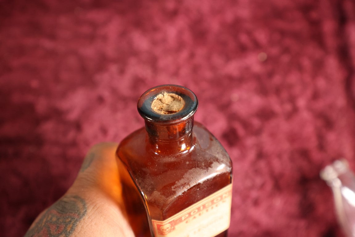 Lot 132 - Antique Amber Glass Bottle With Poison Label From F.C.M Lendholt, Skull And Crossbones, Label May Have Been Added Later