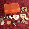 Lot 041 - Miscellaneous Smalls Discovery "Junk Drawer" Lot In Leather Box Marked M.G., Skunks, Coins, And More