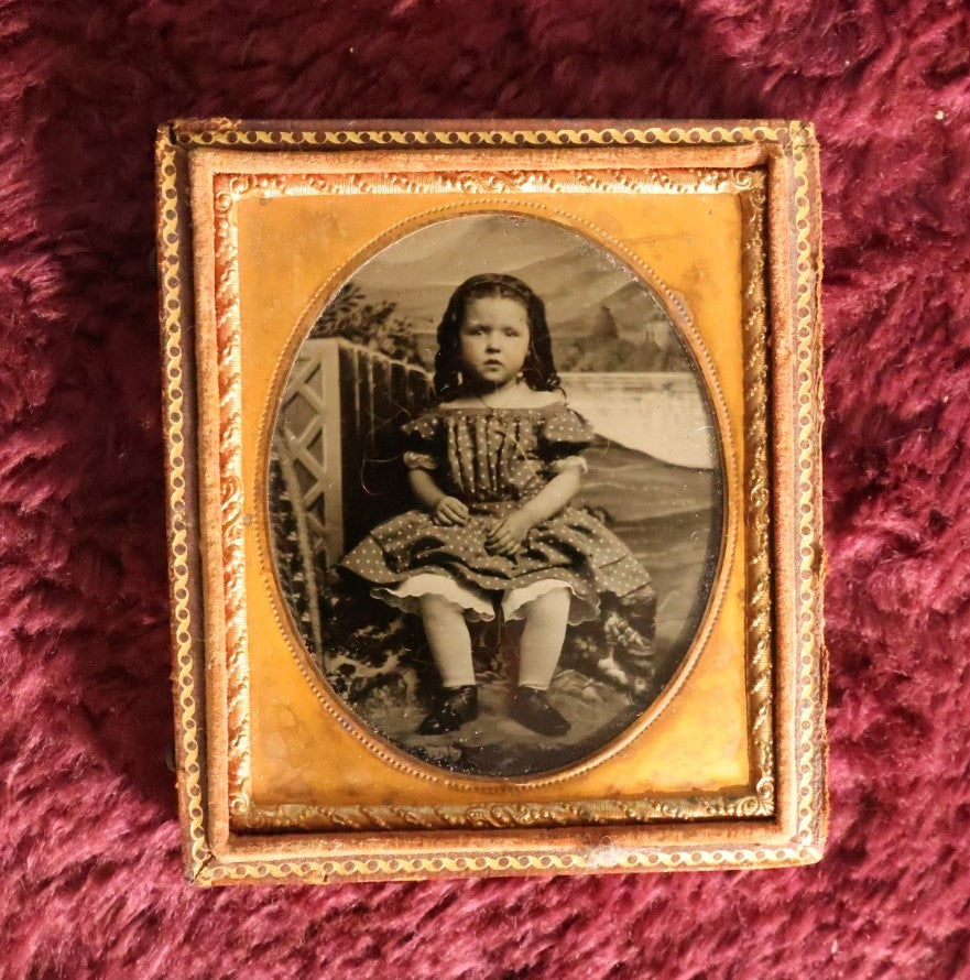 Lot 069 - Antique 1/6th Plate Ambrotype Photograph Of Young Girl In Polka Dot Dress, Outdoor Studio Scene, In Half Leatherette Case