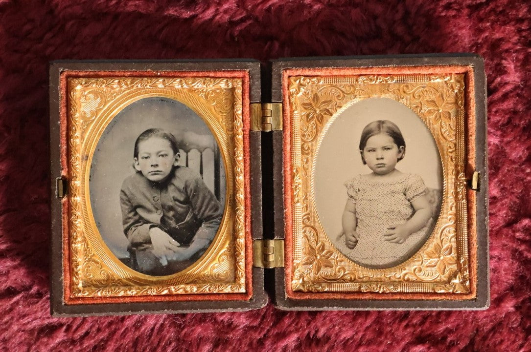 Lot 070 - Antique Double 1/9th Plate Ambrotype Photos In Thermoplastic Case; One Ruby Ambroype Of Young Man With Unusual Posture, Traditional Ambrotype Of Young Girl, Note Different Mats