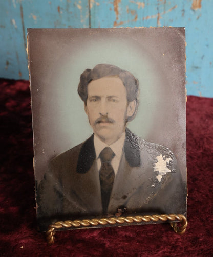 Lot 097 - Full Plate Hand Colored, Hand Tinted Tintype Of Man In Suit With Tie, Blue Background, Note Losses To Shoulder