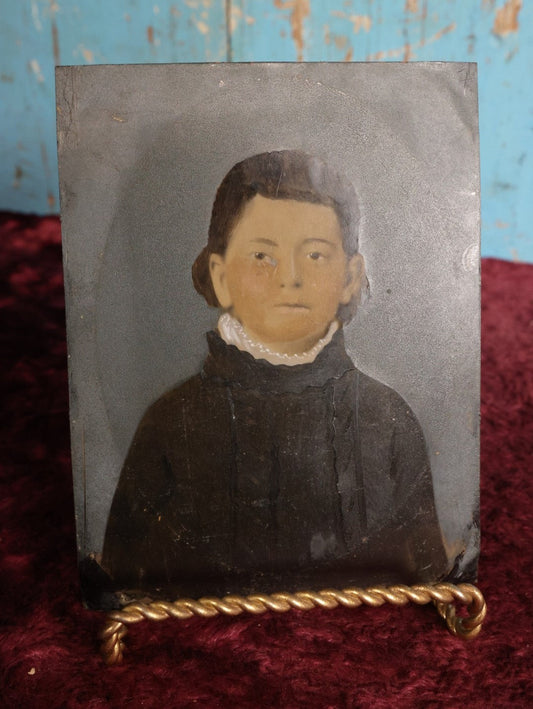 Lot 098 - Full Plate Hand Colored, Hand Tinted Tintype Of Young Child Biting Lip, White Collar, Black Shirt