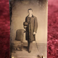 Lot 112 - Tintype - Young Man Holding Bowler Cap, Long Coat, Holding Swagger Stick Cane