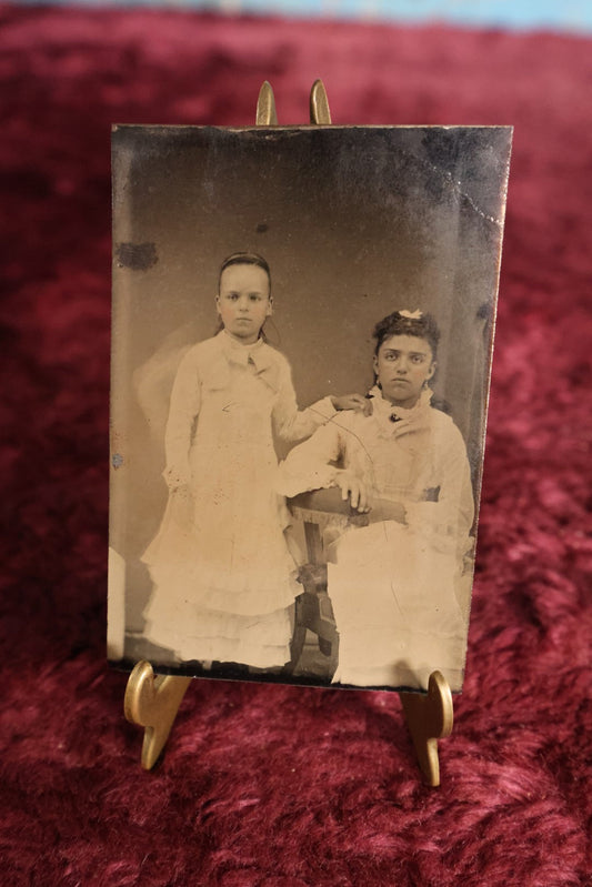 Lot 119 - Tintype - Two Young Girls, One Standing With Hand On Shoulder Of Other Girl Who Is Seated, Both Dressed In White