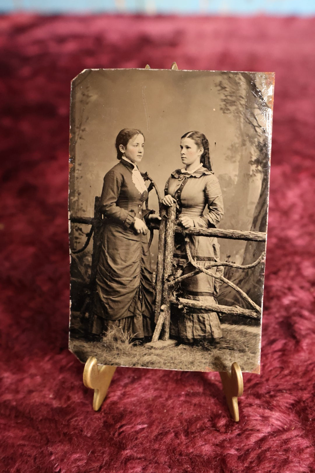 Lot 120 - Tintype - Two Pretty Young Women Standing On Opposite Sides Of Branch Fence Set Piece