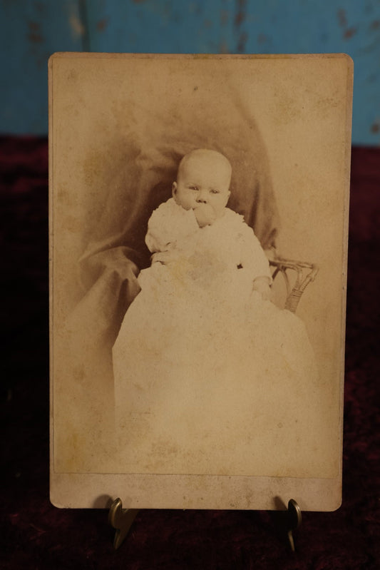 Lot 144 - Cabinet Card - Baby Sitting In Chair, Sucking Thumb, Black Sheet, Identified As Harriet May Hyde, Dec1880, At 6 Months Old, Frank Russell, Photographer, Lawrence, Massachusetts, Ph