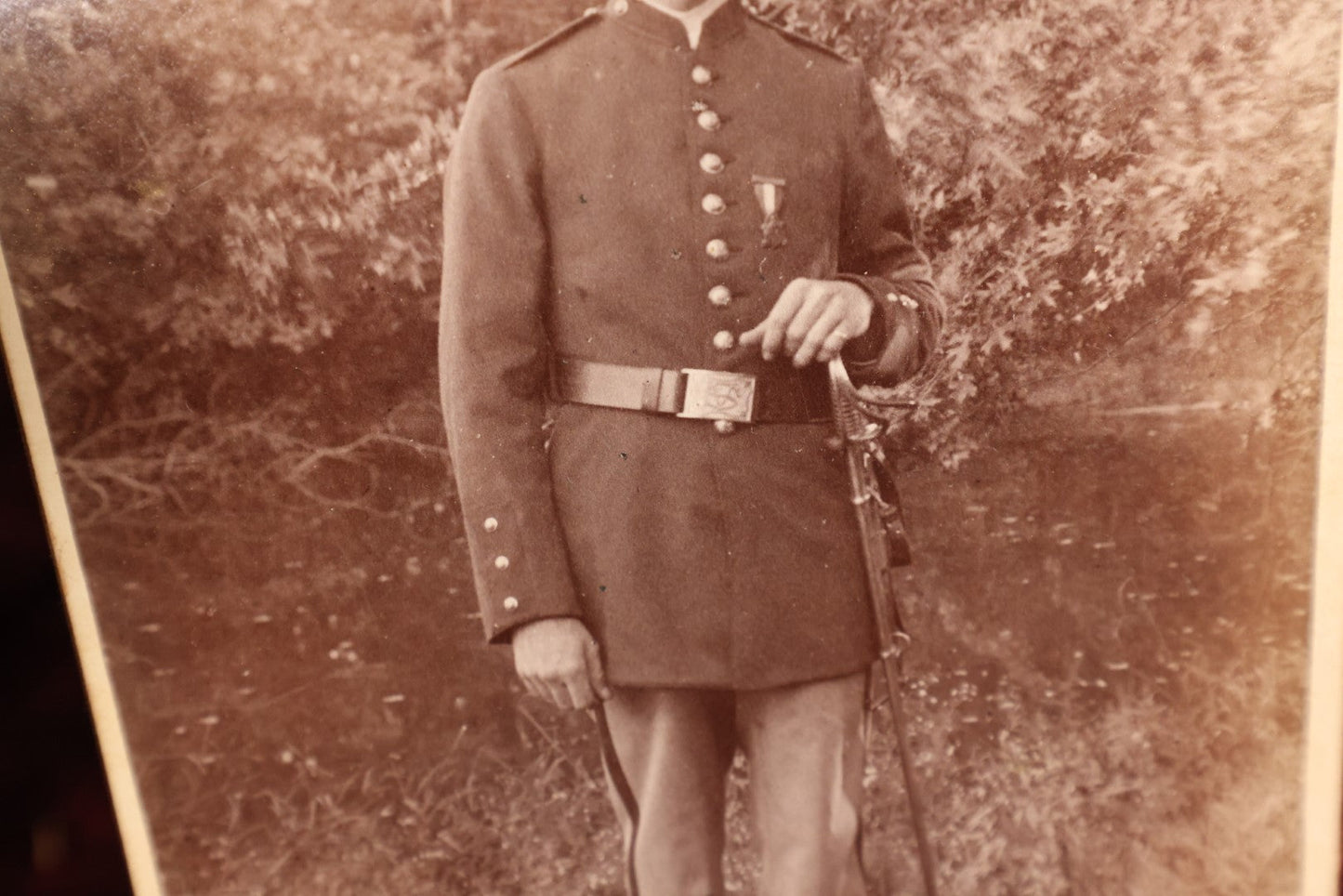 Lot 147 - Cabinet Card - Solder Standing With Hand Resting On Sword Hilt, Cap, Stripe Down Pants, Outdoor Photo, Wearing Medal