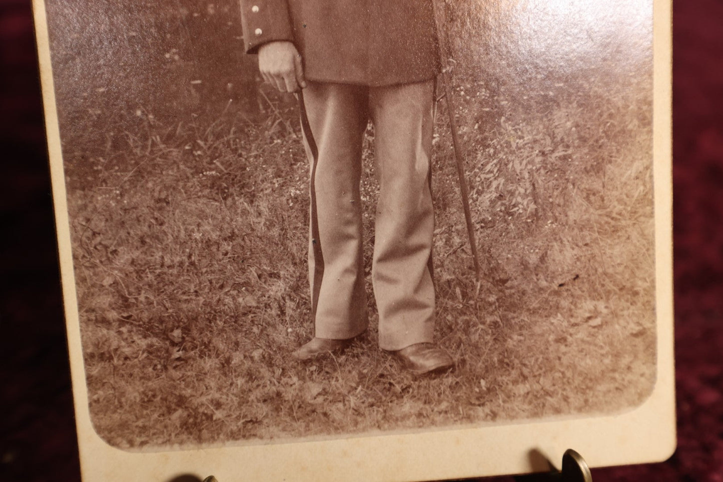 Lot 147 - Cabinet Card - Solder Standing With Hand Resting On Sword Hilt, Cap, Stripe Down Pants, Outdoor Photo, Wearing Medal