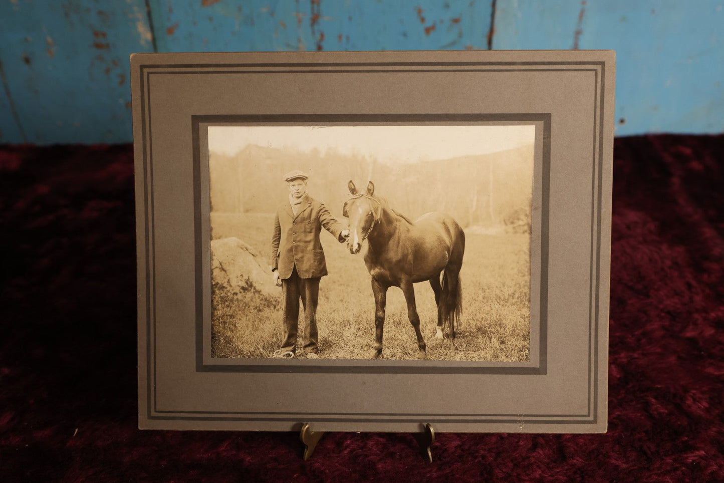 Lot 154 - Boarded Photo - Young Man In Scally Cap Holding Small Horse, Outdoor Photo