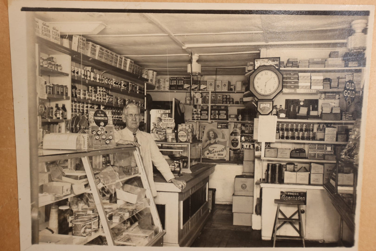 Lot 156 - Boarded Photo - Old Man Behind Counter Of General Store, Many Products And Advertisments, Old Gold Tobacco Sign