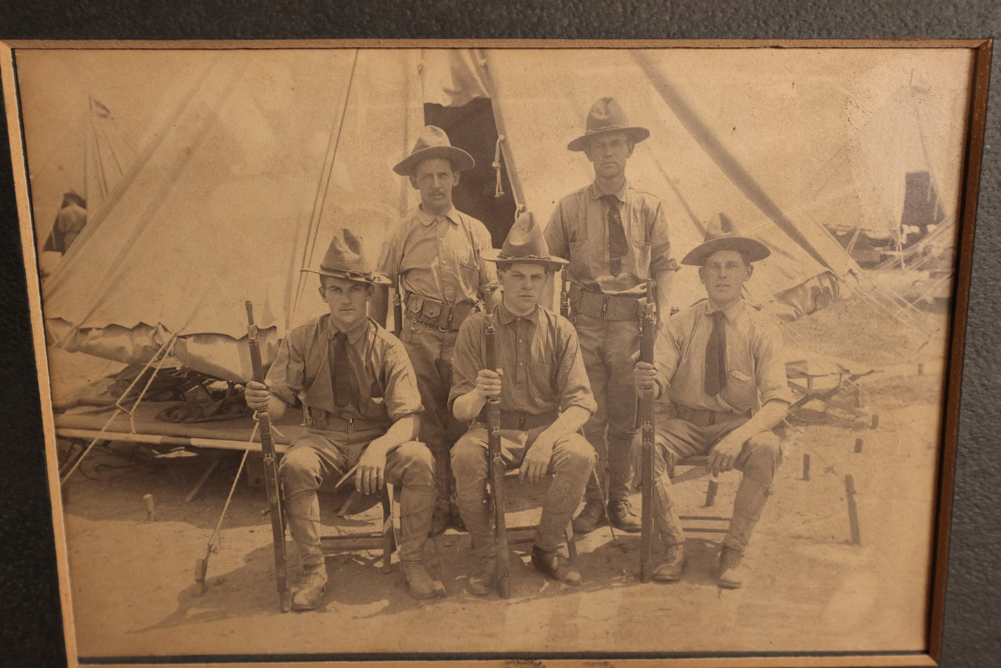 Lot 157 - Boarded And Matted Photo - Very Young Looking Soldiers Sitting With Older Soldiers Standing Outside Tent, Holding Rifles