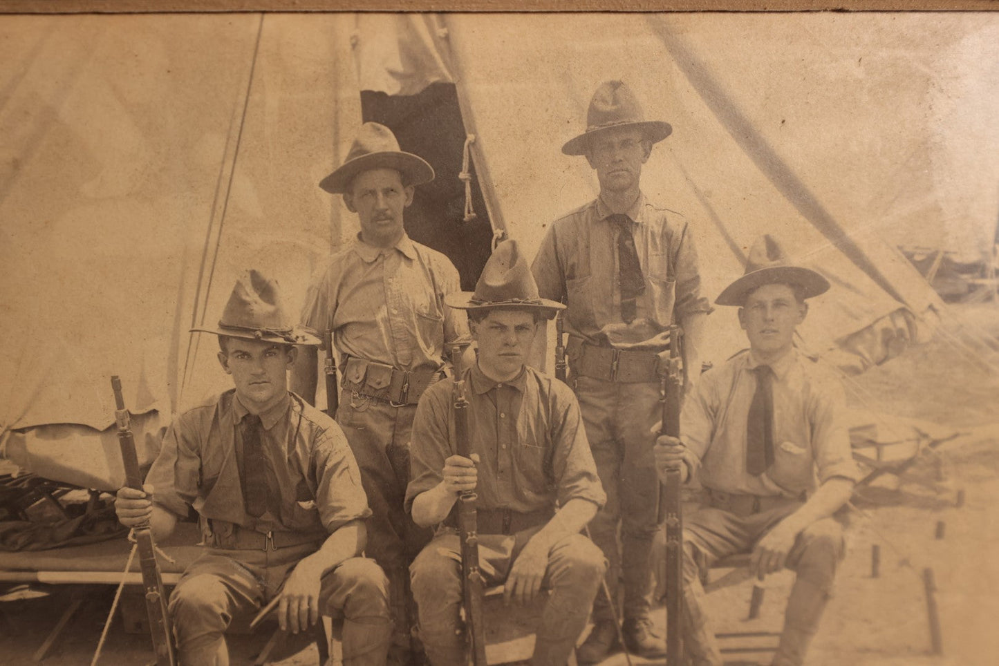 Lot 157 - Boarded And Matted Photo - Very Young Looking Soldiers Sitting With Older Soldiers Standing Outside Tent, Holding Rifles