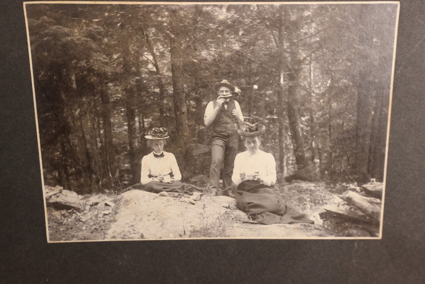 Lot 162 - Boarded Photo - Man And Two Women Having Picnic, Man Eating Watermelon, Old Furnace, Connecticut, Identified On Back