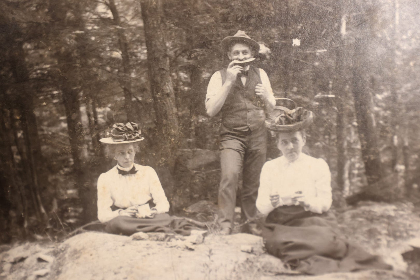 Lot 162 - Boarded Photo - Man And Two Women Having Picnic, Man Eating Watermelon, Old Furnace, Connecticut, Identified On Back