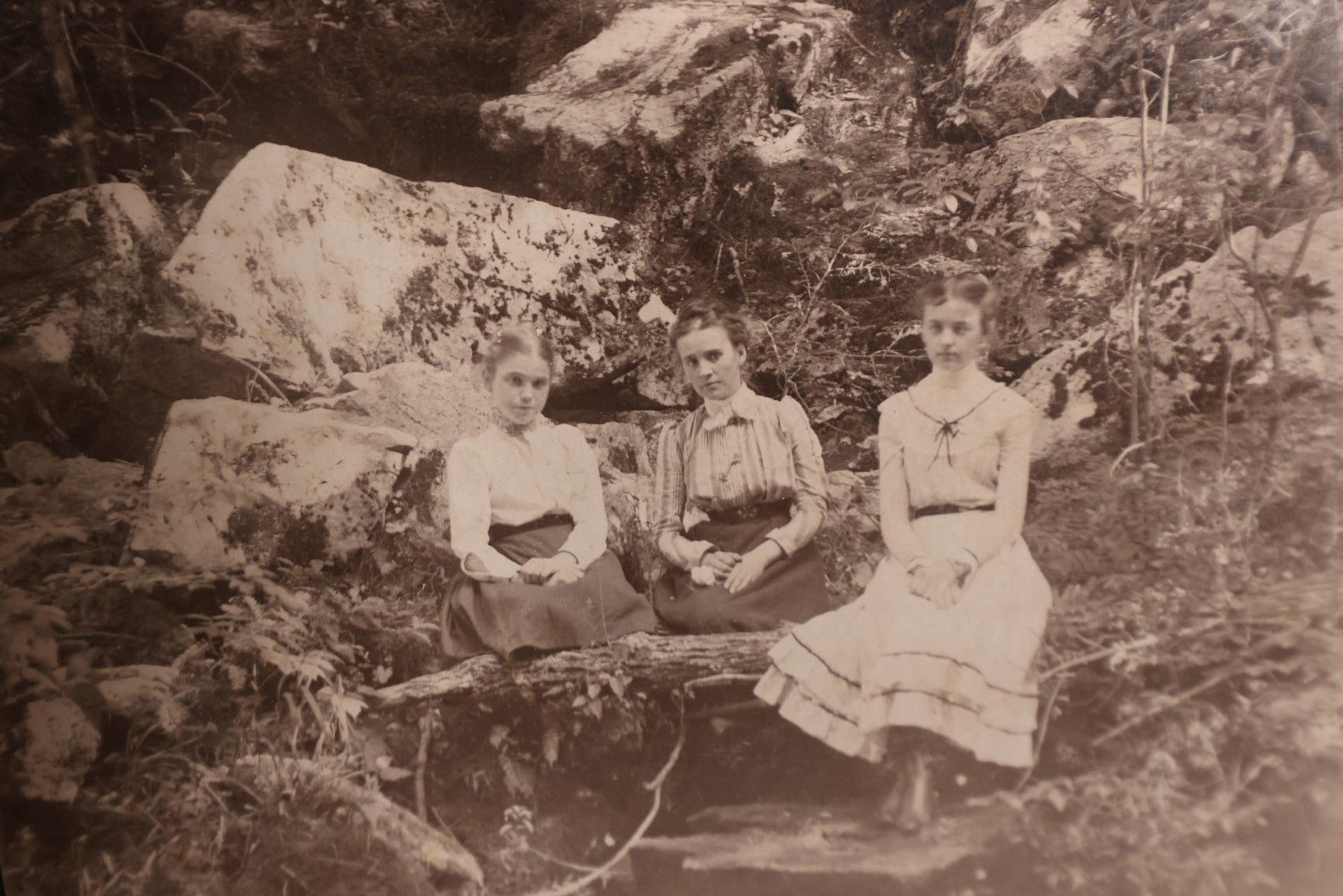 Lot 163 - Boarded Photo - Three Young Girls Sitting At Base Of Rock Fixture, Sitting On Log, Old Furnace, Connecticut, Identified On Back