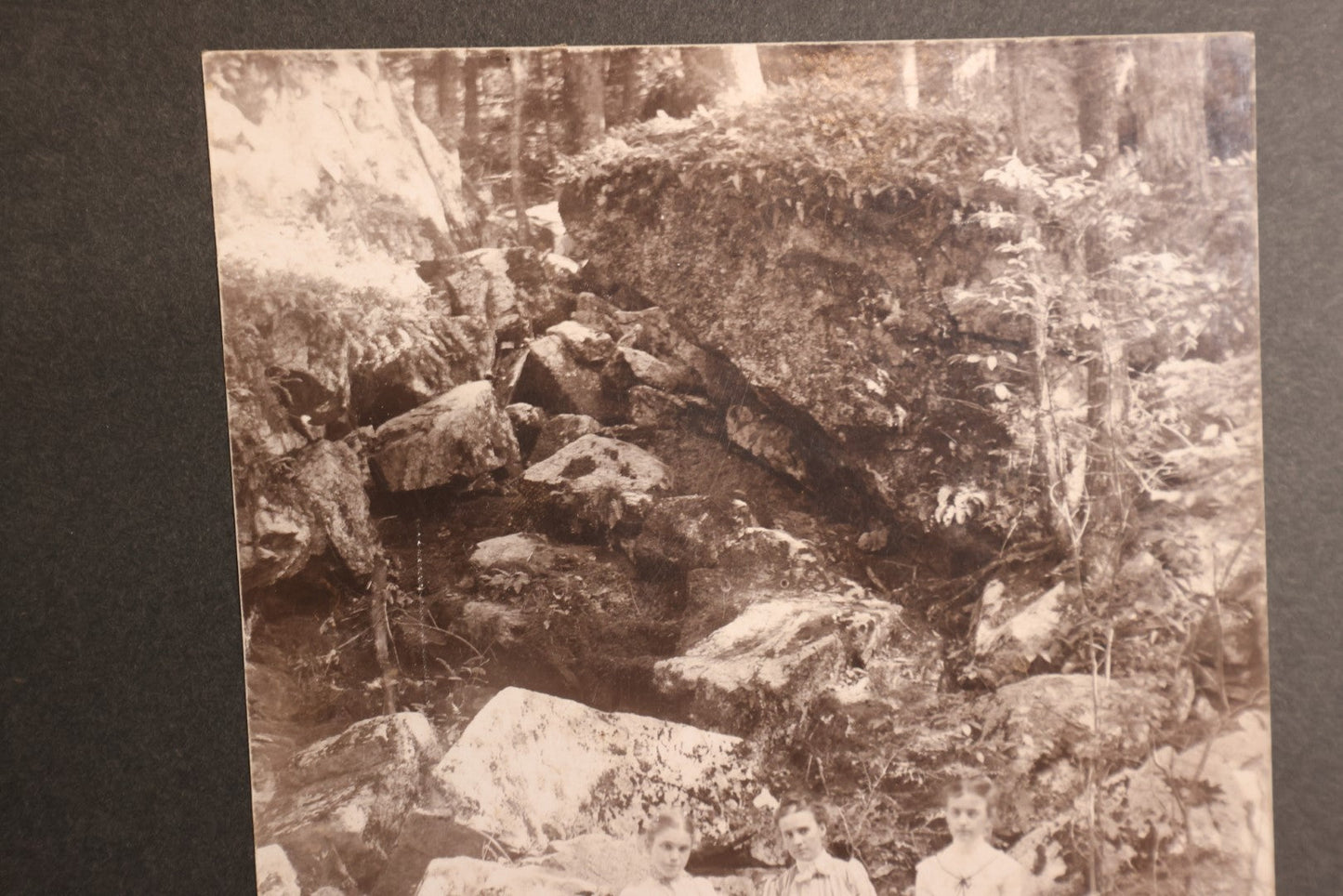 Lot 163 - Boarded Photo - Three Young Girls Sitting At Base Of Rock Fixture, Sitting On Log, Old Furnace, Connecticut, Identified On Back