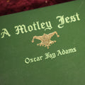 Lot 169 - Book - "A Motley Jest" By Oscaer Fay Adams, Book With Jester On Cover, Vintage, Short Stories And Vignettes, 1909 Edition