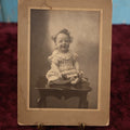Lot 180 - Single Photo - Boarded Photo of The World's Happiest Baby, Osgood Studio, Berlin, N.H.