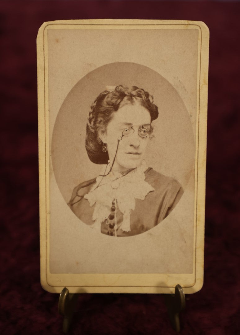 Lot 181 - Single Photo - Interesting CDV of Woman Wearing Eyeglasses, Odd Pupils, E.M. Van Aken Photographer, Lowville, New York