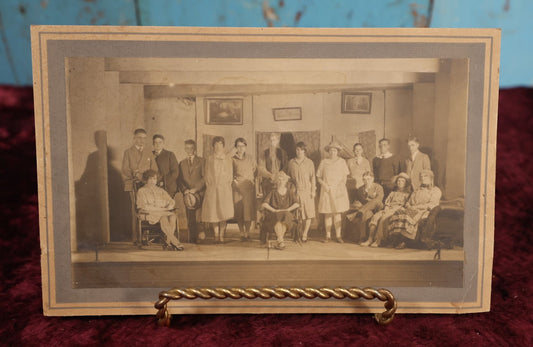 Lot 187 - Single Photo - Early 20th Century Cast of A Stage Play, Young People In Costume, Embroidered Motto On Wall