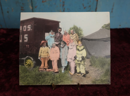 Lot 021 - Antique Colored Photograph of Nine Clowns In Costume By Circu Train, Tent, Early Sideshow Behind The Scenes Photo