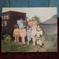 Lot 021 - Antique Colored Photograph of Nine Clowns In Costume By Circu Train, Tent, Early Sideshow Behind The Scenes Photo