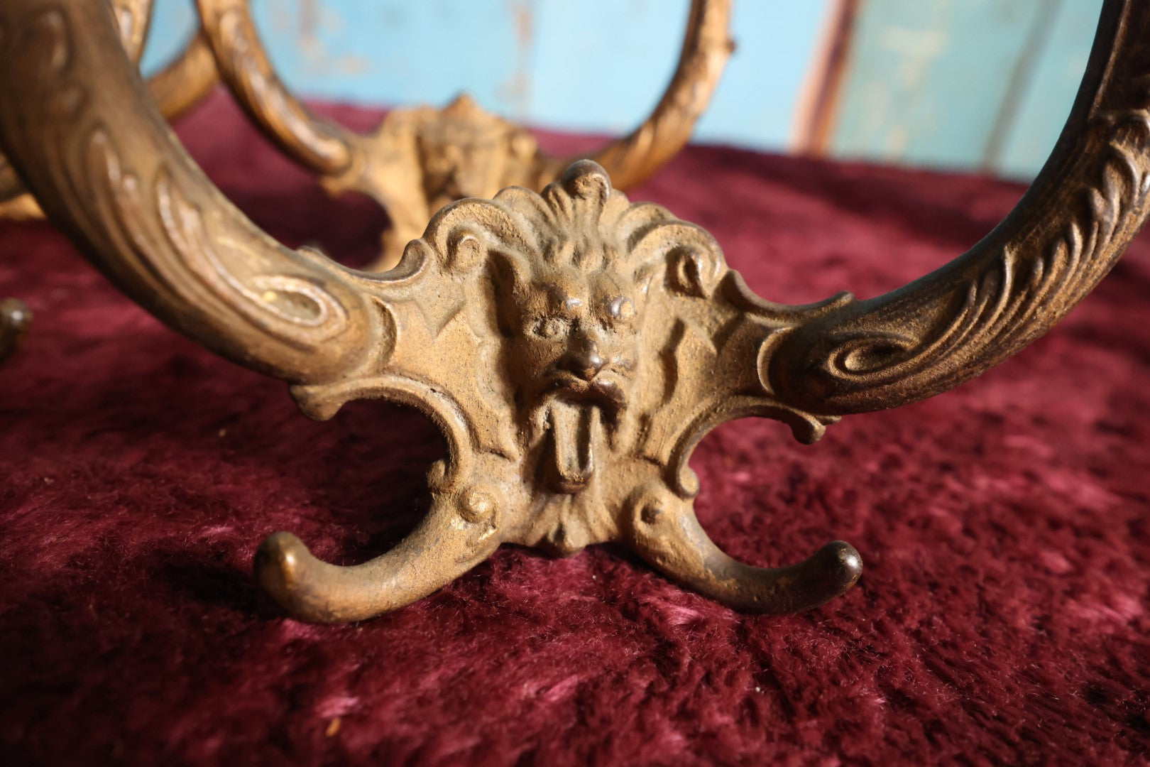 Lot 024 - Grouping of Four Antique Neoclassical Ornate Gold Painted Cast Iron Hardware Coat Hangers With Figural Lion Face With Flanges, Screws, Nuts