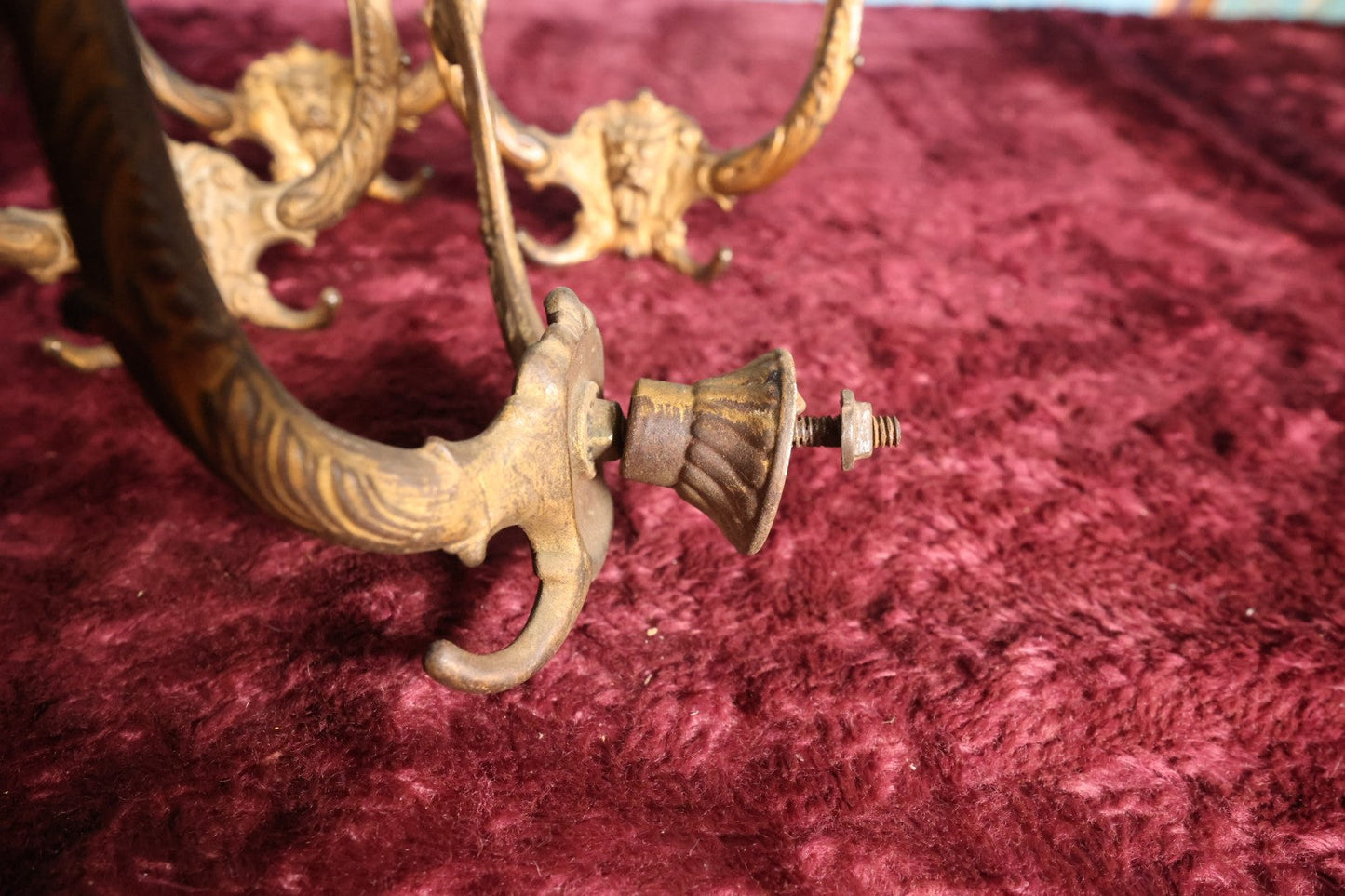 Lot 024 - Grouping of Four Antique Neoclassical Ornate Gold Painted Cast Iron Hardware Coat Hangers With Figural Lion Face With Flanges, Screws, Nuts