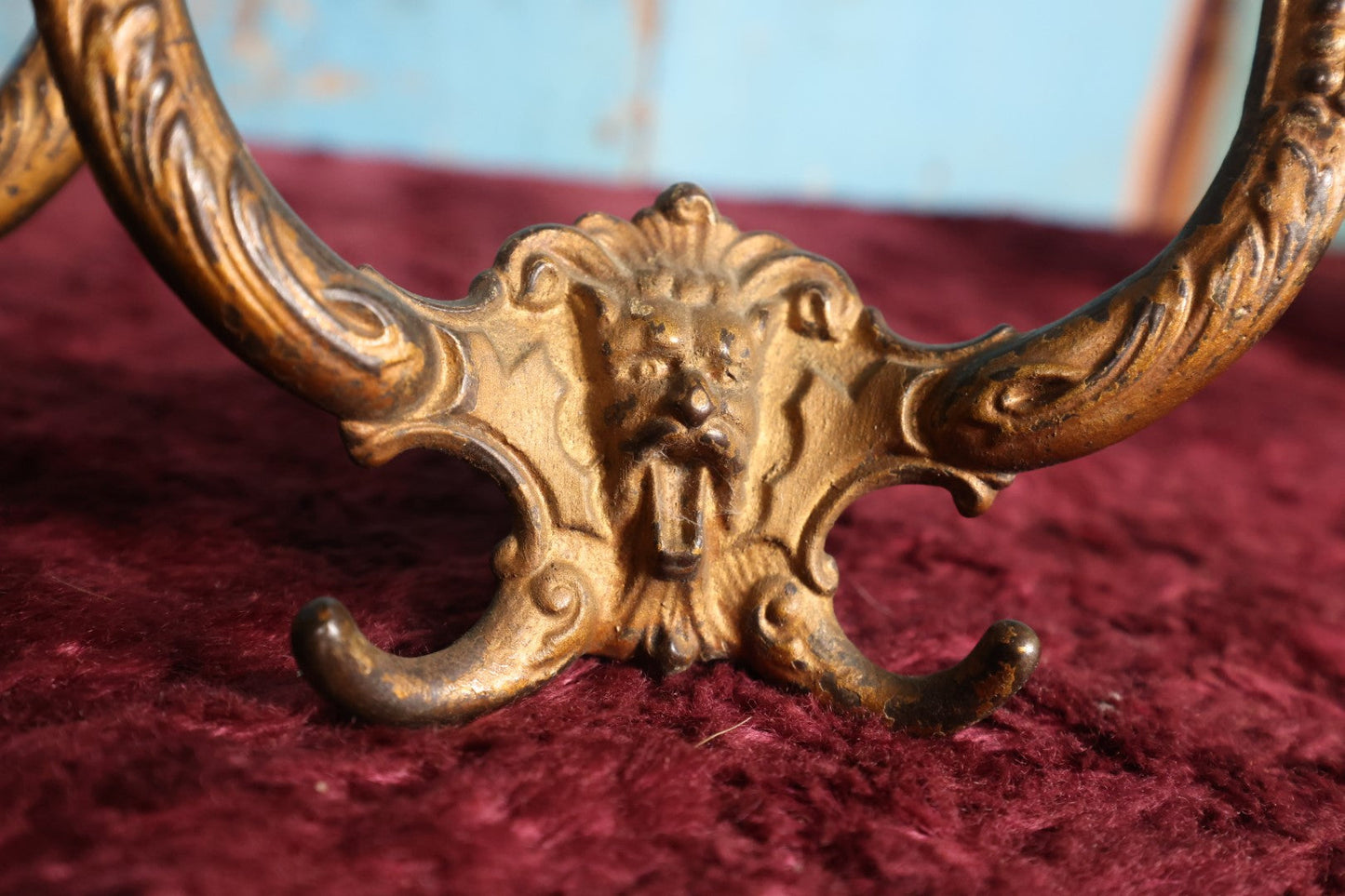 Lot 024 - Grouping of Four Antique Neoclassical Ornate Gold Painted Cast Iron Hardware Coat Hangers With Figural Lion Face With Flanges, Screws, Nuts