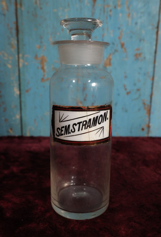 Lot 031 - Antique Sem Stramon (Stramonium, Jimsonweed, Devil's Trumpet, Thronapple) Apothecary Bottle With Glass Label, Stopper, Approximately 10", Used For Hallucinagentic Properties In Occult Rituals, Medicine, Note Crack Down Label