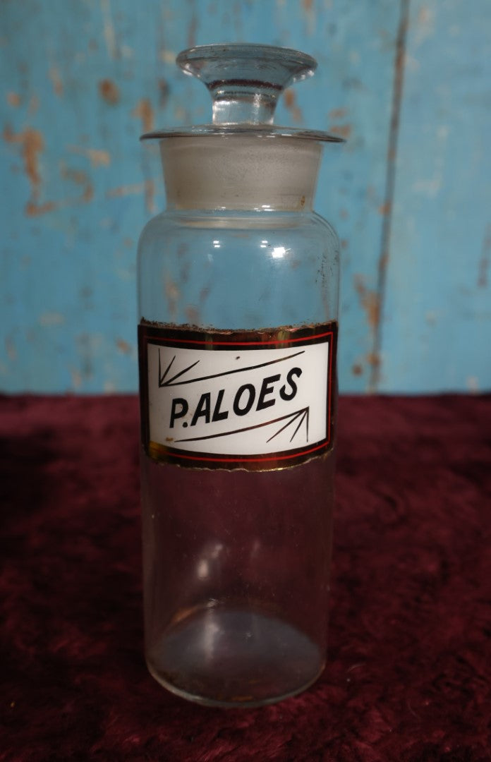 Lot 033 - Antique Pulvis Aloes, Pulverized Aloe Vera, Apothecary Bottle With Glass Label, Stopper, Approximately 9.5"