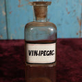 Lot 035 - Antique Vinum Ipecacuanhae / Ipecac Wine Apothecary Bottle With Glass Label, Stopper, Approximately 6.75", Emetic Used To Induce Vomiting