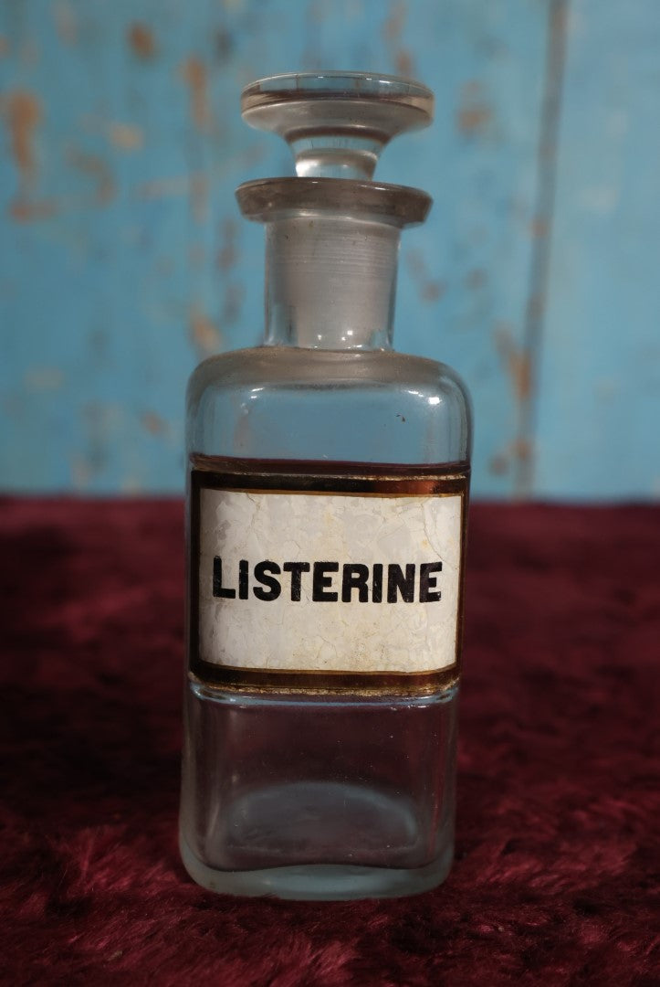 Lot 039 - Antique Listerine, Anti-Septic / Mouthwash Apothecary Bottle With Glass Label, Stopper, Approximately 5", Early Use Included Treatment of Gonorrhea