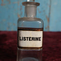 Lot 039 - Antique Listerine, Anti-Septic / Mouthwash Apothecary Bottle With Glass Label, Stopper, Approximately 5", Early Use Included Treatment of Gonorrhea