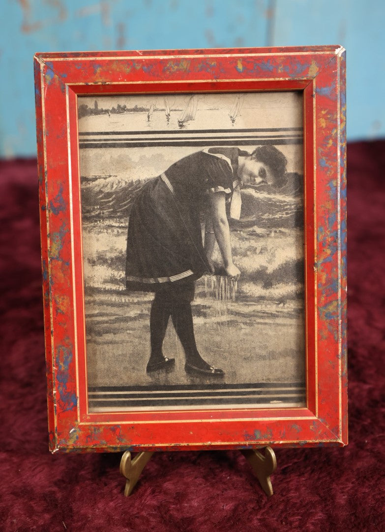 Lot 107 - Antique Framed Clipping Image Photo of Young Woman At Beach Ringing Out Her Dress, Red Painted Frame With Paint Splatter, Wood Back