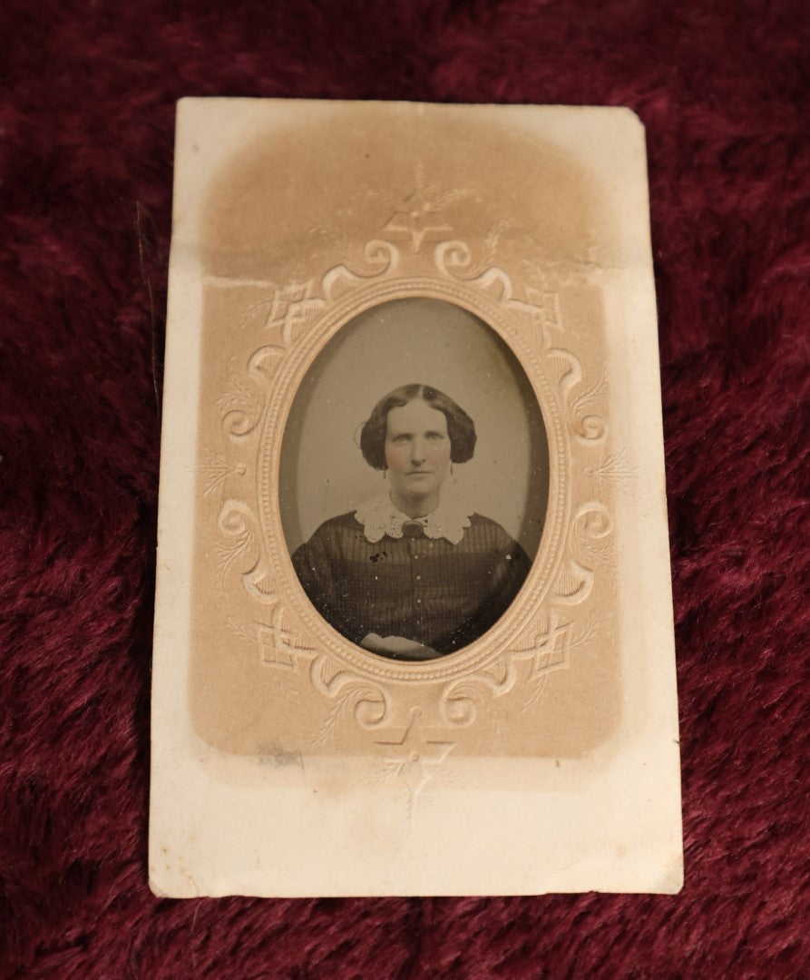 Lot 109 - Antique Ambrotype Photograph of Young Woman Wearing White Collar, Uncased, With Paper Frame And Fabric Textile Tape Lack Backing, 1/9th Plate