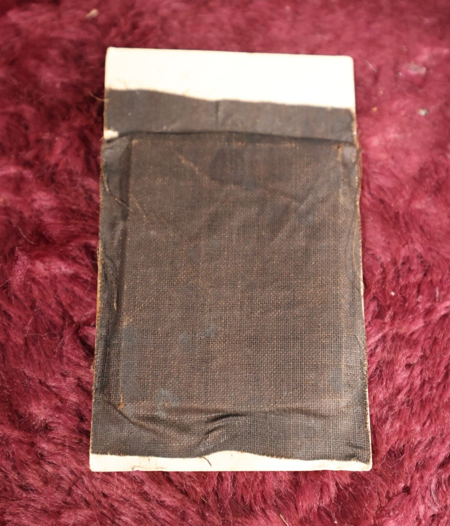 Lot 109 - Antique Ambrotype Photograph of Young Woman Wearing White Collar, Uncased, With Paper Frame And Fabric Textile Tape Lack Backing, 1/9th Plate