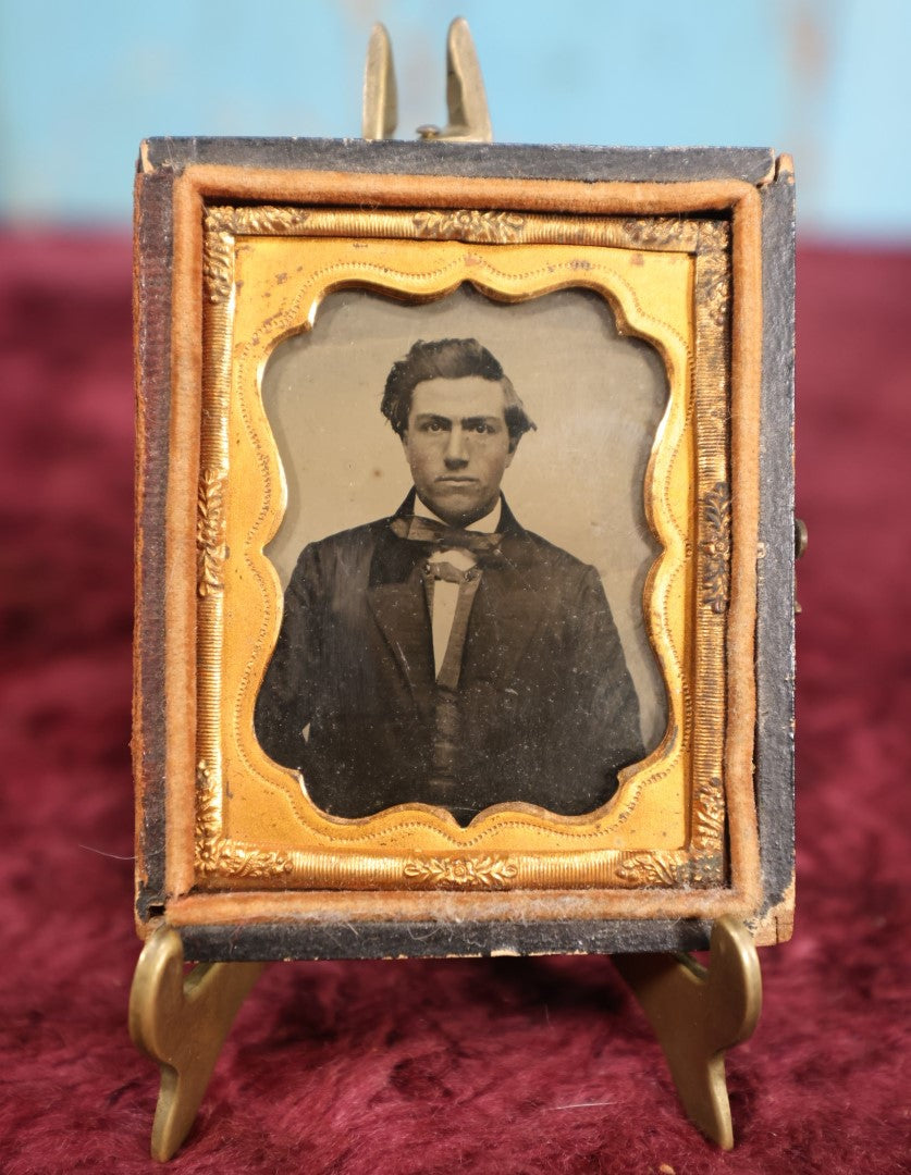 Lot 110 - Antique Ambrotype Photograph of Young Man In Bowtie, Swoopy Hair, In Half Leatherette Union Case, 1/9th Plate