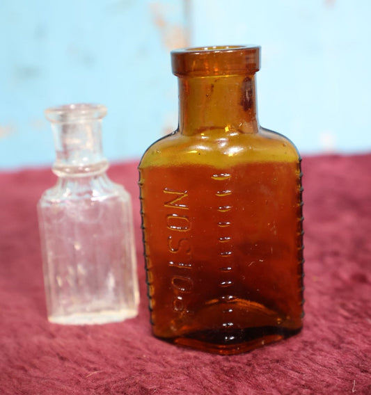 Lot 155 - Two Piece Poison Bottle Lot, Amber Bottle With Raised Letters, Small Clear Bottle